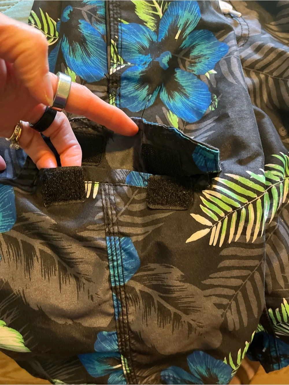 Pair of Kanu Surf Men's Blue Camo & Black Floral Swim Trunks